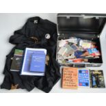 Suitcase containing magic tricks and magic related books and self-learning course manuals. Also