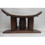 African Ashanti style hardwood head rest with incised and pierced decoration, W45cm H26cm
