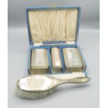 ERII cased silver four piece dressing table set, Daniel Manufacturing Company, Birmingham 1958 and a