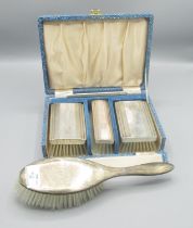 ERII cased silver four piece dressing table set, Daniel Manufacturing Company, Birmingham 1958 and a