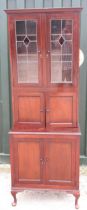 Early C20th mahogany side cabinet, with two lead glazed doors above a pair of panel doors,