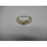 18ct white and yellow gold diamond ring, the four diamonds set together in rub over setting, stamped