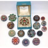 Sixteen Strathearn glass paperweights, most millefiori, one boxed, max. D7.5cm