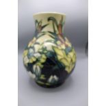 Moorcroft Pottery: Lamia pattern baluster vase of baluster form, tube lined with bullrushes and