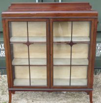 C20th mahogany display cabinet, galleried back above two astragal glazed doors on square