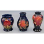 Moorcroft Pottery: Pomegranate pattern vases, H10cm/H9.5cm/H8.5cm (3)