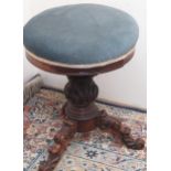Victorian adjustable piano stool, circular upholstered top on three carved outsplayed legs