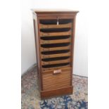 Early C20th golden oak filing cabinet, tambour front opening to reveal nine drawers, W49cm D43cm