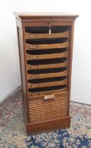 Early C20th golden oak filing cabinet, tambour front opening to reveal nine drawers, W49cm D43cm