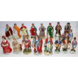 Thirteen Alfretto porcelain figures of British monarchs, max. H23cm, and a group of figures of six