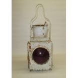 Early C20th white painted railway signal lamp with red glass lens