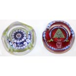 Two Whitefriars millefiori glass Christmas paperweights, one with angel canes, and another with