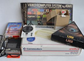 Boxed Commodore Amiga Model 500, an Atari Video Computer System (controllers and game instructions