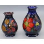 Moorcroft Pottery: Clematis pattern vases, H11.5cm and H9.5cm (2)