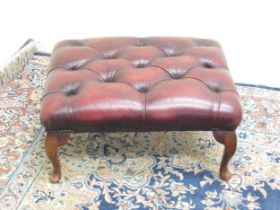 Chesterfield style footstool with deep buttoned burgundy leather top on cabriole legs, W60cm