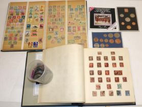 Two world stamp albums, and a collection of commemorative coins