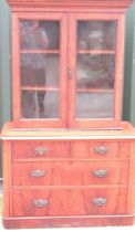 Victorian mahogany cupboard on chest, with two glazed doors above two short and two long curl veneer