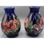 Moorcroft Pottery: pair of Anemone pattern ovoid vases with flaring necks, tube lined with pink to
