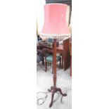 George 111 style mahogany tripod standard lamp with lobed and fluted column and pink fringed