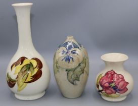 Moorcroft Pottery: Magnolia pattern vase, H9cm; autumn leaf design vase with Queen Mary sticker,