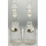 Pair of Victorian mallet shaped decanters, with facet cut shoulders, ringed neck and faceted