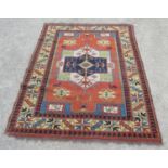Afghan style rug, the orange field with hut geometric medallion stylised animals and figures