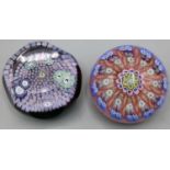 Perthshire carpet ground glass paperweight, containing six large millefiori canes, signature cane