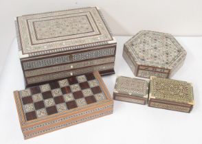 Folding wooden backgammon/chess games box with mother of pearl inlay, four wooden jewellery boxes