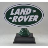 WITHDRAWN - Relief cast metal Land Rover sign on wood base, W40cm D13.5cm H37cm.