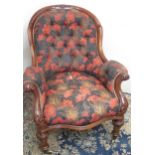 Victorian carved mahogany framed arm chair, buttoned back and serpentine seat on carved legs with