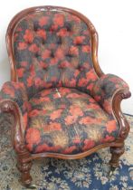 Victorian carved mahogany framed arm chair, buttoned back and serpentine seat on carved legs with