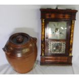 Large salt glazed jar with lid. Ornately decorated wall clock.