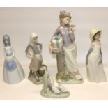 Lladro figure of a girl with milk pail and duck, H24cm; Nao figure group of three ducks; and three