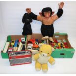 Three boxes of die-cast model vehicles, incl. Matchbox; three mid C20th soft toys incl. a monkey;