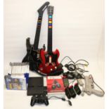Sony PlayStation 2 PS2 console, various controllers incl. two Guitar Hero guitars, Singstar