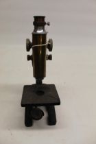 C20th brass and japanned microscope on triform base, no visible maker, H33cm