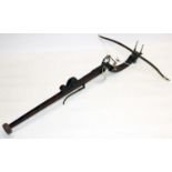 Circa C17th Continental pellet crossbow, mahogany stock with carved "S" scroll and steel fittings