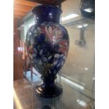 Moorcroft Pottery: Spring Flowers pattern baluster urn vase, tube lined with pink, yellow and blue