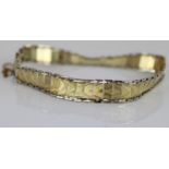 14ct yellow and white gold articulated bracelet with box clasp and safety chain, stamped 585, 8.6g