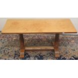 Wilf Squirrel Man Hutchinson - an oak coffee table, adzed rectangular top on octagonal tapering