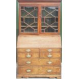 George 111 Country made oak bureau bookcase, with moulded cornice and astragal glazed doors above