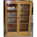 Geoff Unicornman Gell of Coxwold - an oak bookcase, with two bevelled glass doors and three