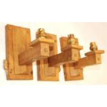 Colin Beaverman Almack of Sutton-under-Whitestonecliffe - a set of three oak wall light fittings,