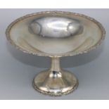 George V hallmarked silver pedestal bon bon dish, with scroll cast borders on tapering circular
