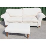 Country House style sofa, with outsplayed arms and loose back and seat cushions, upholstered in self