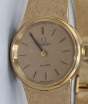 Omega - lady's 9ct gold quartz wristwatch, signed gold coloured textured dial with applied baton