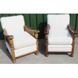Pair of arm chairs, scroll arms with canework panels, with loose seat cushion upholstered in self