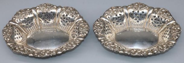 Pair of Victorian hallmarked silver oval pierced bon bon dishes with scroll borders, by Miller