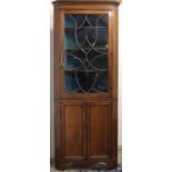 George 111 boxwood strung mahogany standing corner cabinet, gadrooned cornice and scrolled