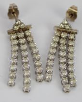 18ct white gold diamond drop earrings, a cluster of three brilliant cut diamonds above three